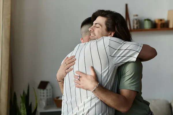 Two men hug tightly, expressing their love and affection for each other. — Stock Photo