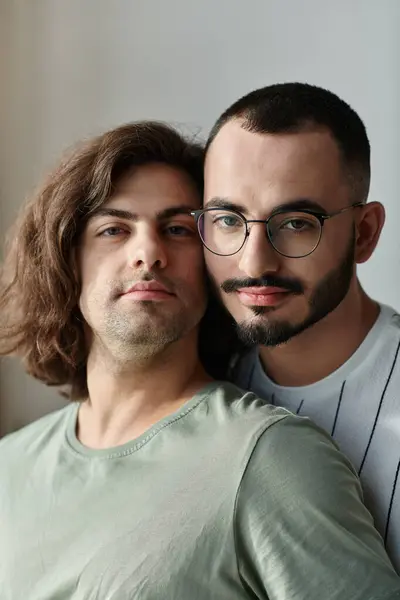 Two men share a tender moment, looking into each other's eyes. — Stock Photo
