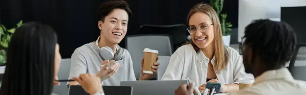 A team of young professionals works on a startup project, discussing ideas and collaborating. — Stock Photo