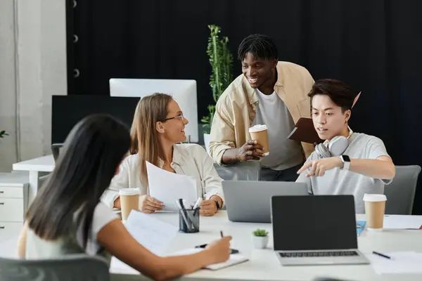 Colleagues discuss a project at office table, showing lively collaboration — Stock Photo