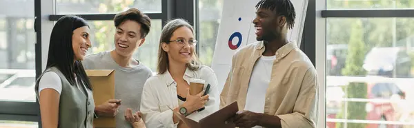 A group of young professionals are working on their startup in a bright and modern office space. — Stock Photo