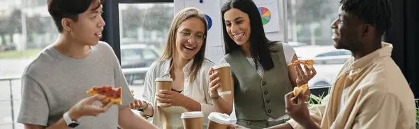 Four colleagues enjoy a break with pizza and coffee. — Stock Photo
