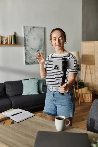 A cheerful woman with vitiligo captures her joyful moments indoors. — Stock Photo