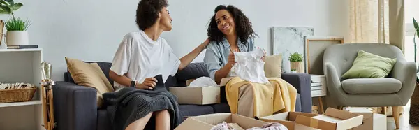 A loving couple engages in creative clothing upcycling in their stylish home. — Stock Photo