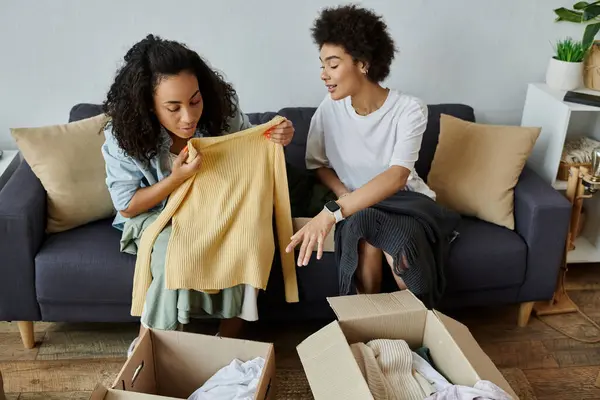 Two partners transform clothing items while enjoying each other's company. — Stock Photo