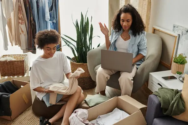 LGBT couple joyfully revamping their clothes amidst a cozy and inviting atmosphere. — Stock Photo