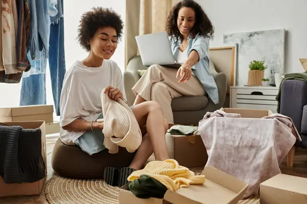 Couple joyfully transforms old clothes into fresh styles at home. — Stock Photo