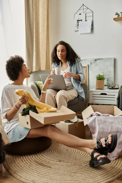 A couple joyfully collaborates to upcycle garments at home. — Stock Photo