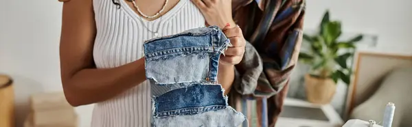 An LGBT couple joyfully transforms their old clothes with artistic flair. — Stock Photo