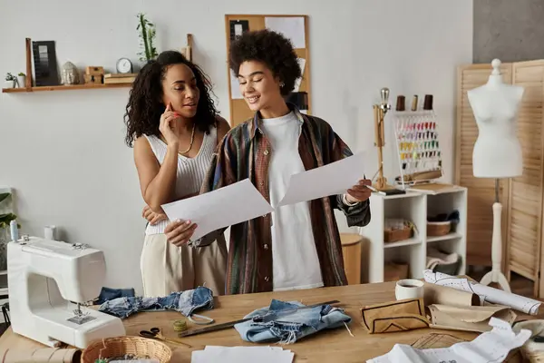 Couple joyfully transforms their clothing in a cozy workspace. — Stock Photo