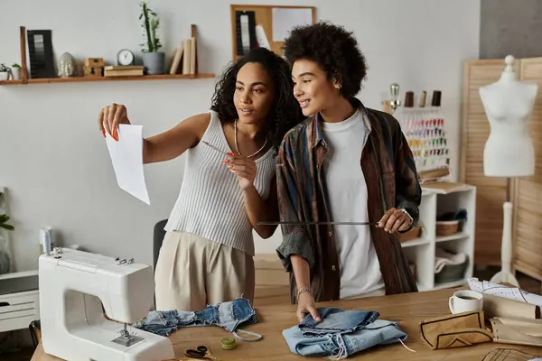 An LGBT couple joyfully upcycles their clothes, sharing ideas and creativity. — Stock Photo