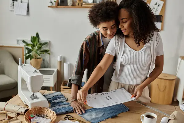 Couple joyfully transforming old garments into stylish new pieces. — Stock Photo