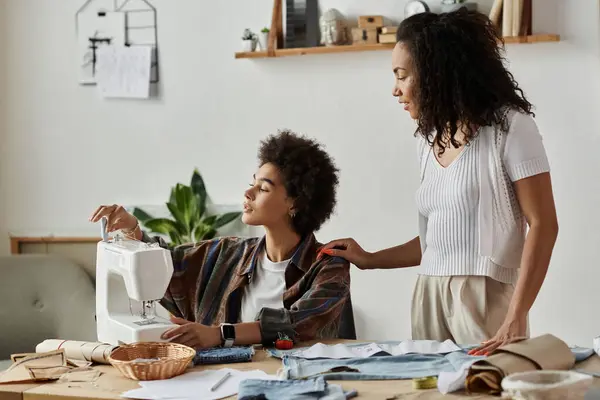 Couple joyfully transforming old clothes into new art in their cozy workspace. — Stock Photo