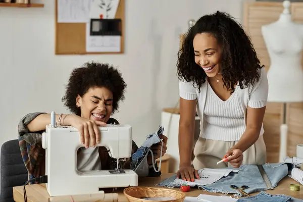 LGBT couple joyfully transforms old clothes with sewing machine and creativity. — Stock Photo