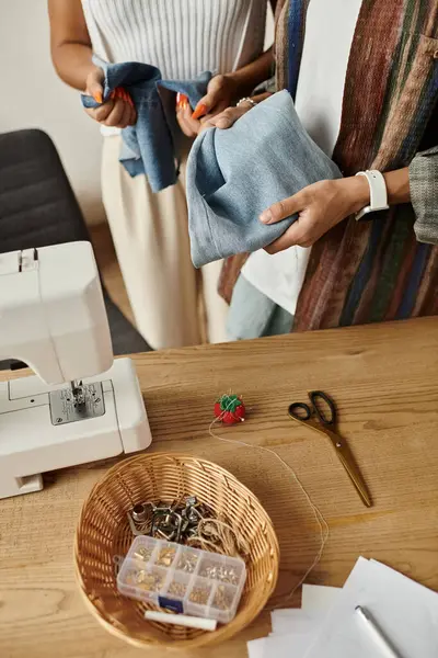 Woman joyfully transforms old clothing into stylish new pieces together. — Stock Photo