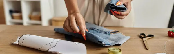 Woman joyfully transforms old garments into fresh styles at home. — Stock Photo