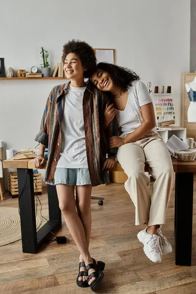 Loving couple joyfully posing, inviting workspace. — Stock Photo