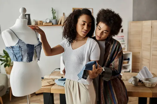 Two partners transform clothes while sharing smiles and creativity. — Stock Photo