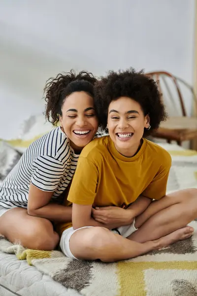 A loving couple shares laughter and warmth on a sunny day indoors. — Stock Photo