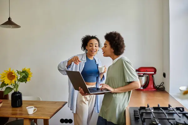 A couple enjoys a light-hearted moment while working together. — Stock Photo