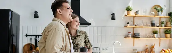 Two friends share laughter and warmth in a chic kitchen setting. — Stock Photo