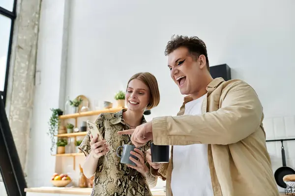 Friends share a joyful moment over coffee, enjoying their cozy home together. — Stock Photo
