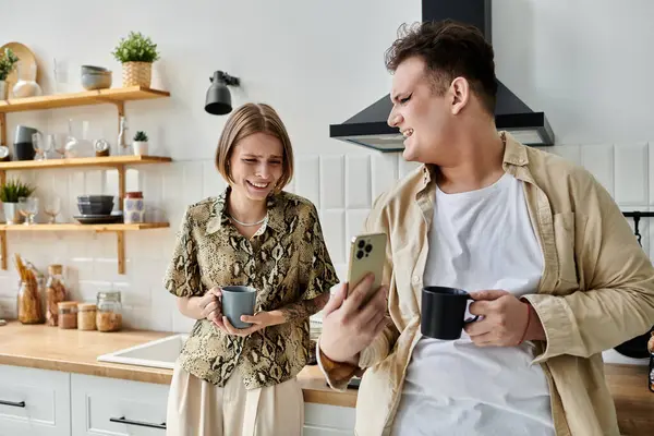 Two friends share a joyful moment while enjoying coffee together. — Stock Photo