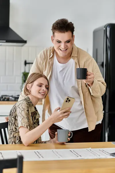 Two friends share laughter and warmth while enjoying coffee together. — Stock Photo