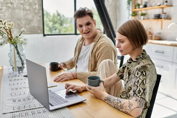 A joyful gathering of two friends sharing a moment over coffee at home. — Stock Photo