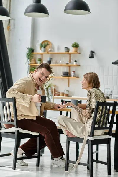 Two friends share laughter and connection in a cozy home environment. — Stock Photo