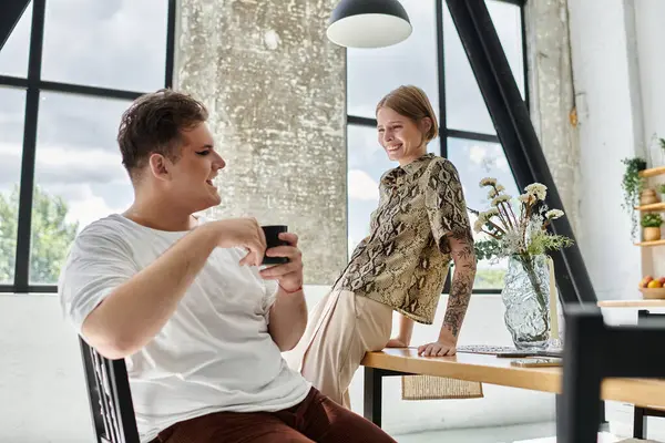 A joyful moment shared between two friends at home, showcasing their vibrant connection. — Stock Photo