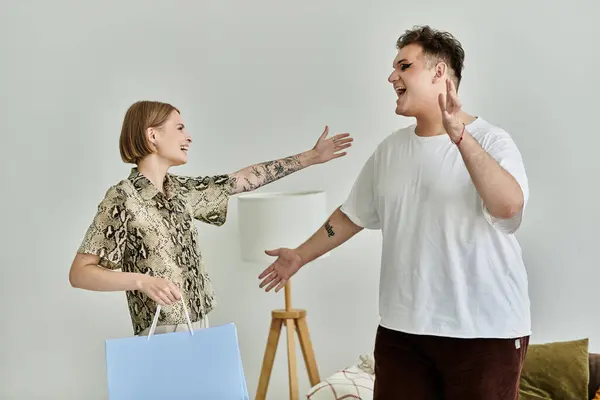 Friends greet each other warmly, celebrating a joyful reunion in their stylish home. — Stock Photo