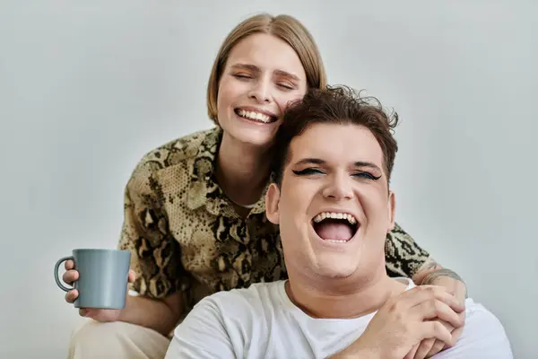Two friends share joyful moments while relaxing indoors. — Stock Photo