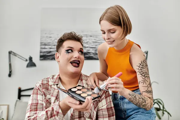A vibrant duo enjoying creativity and connection while applying makeup together. — Stock Photo