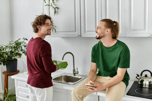 A loving couple shares smiles while preparing a meal together in their cozy kitchen. — Stock Photo