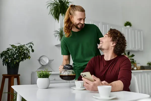A couple shares warmth and laughter over coffee in their cozy kitchen. — Stock Photo