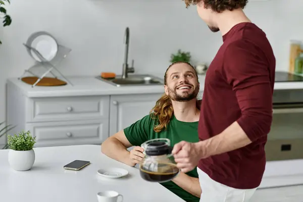 A joyful morning shared by a couple over steaming cups of coffee. — Stock Photo