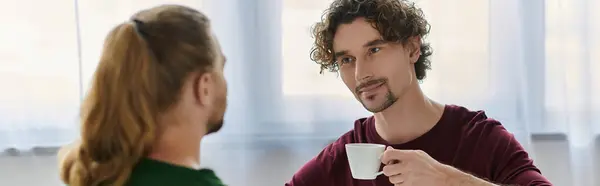 A joyful couple shares a tender moment over morning coffee. — Stock Photo