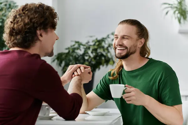 Two men share a tender moment, smiling and enjoying each other. — Stock Photo