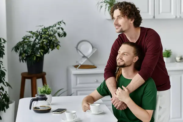 A couple shares a tender moment while enjoying coffee together. — Stock Photo