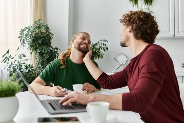 Two men share a tender moment while enjoying each other. — Stock Photo