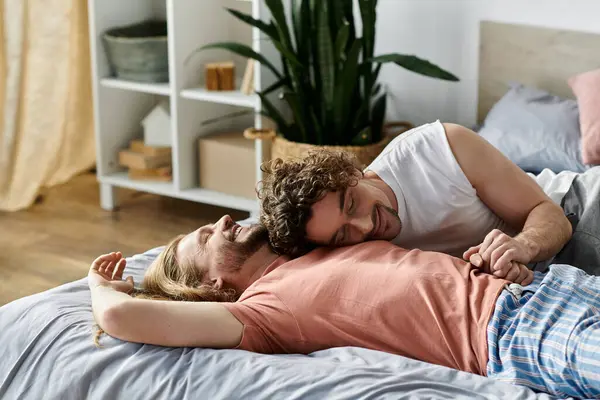 Two partners share affectionate laughter while relaxing in their serene bedroom. — Stock Photo