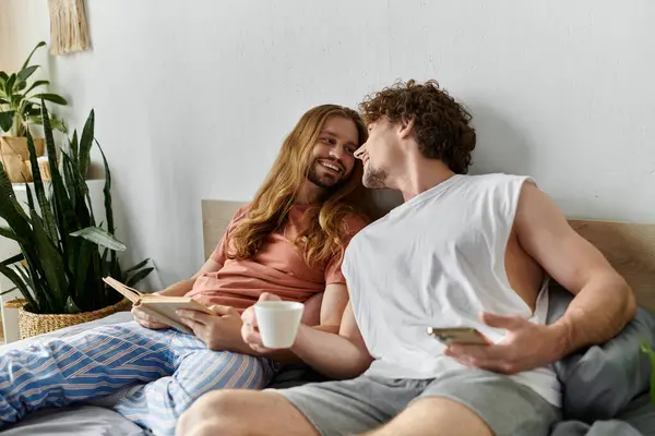 A joyful morning shared over coffee and laughter in a cozy bedroom. — Stock Photo