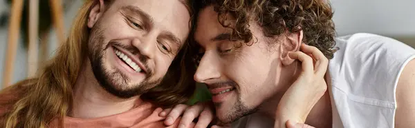 Two men share a tender moment, enjoying each other at home. — Stock Photo