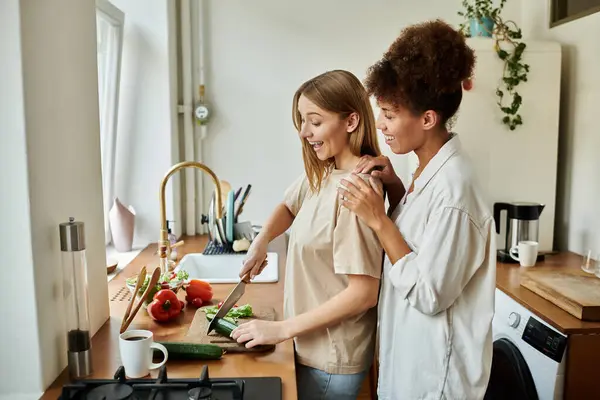 Couple shares a moment of joy while preparing a meal in their home. — Stock Photo