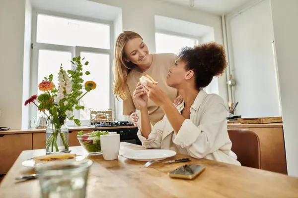 Two partners share a joyful moment over breakfast, radiating warmth and love. — Stock Photo