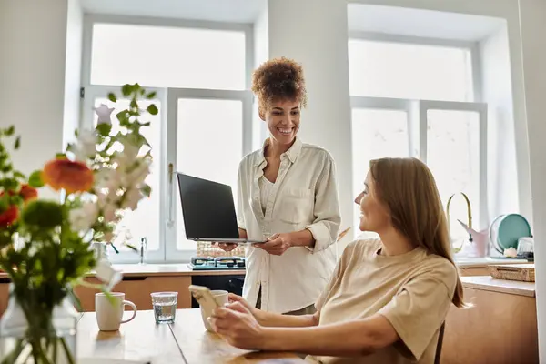 A couple shares smiles while engaging in a relaxed morning chat. — Stock Photo