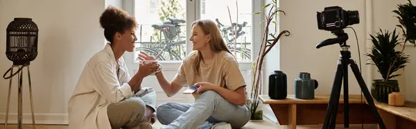A loving couple connects over warm drinks in their stylish room. — Stock Photo
