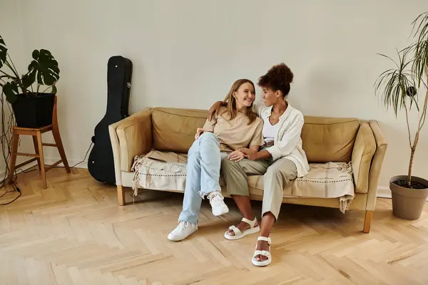 Loving couple enjoys a blissful afternoon on their couch. — Stock Photo