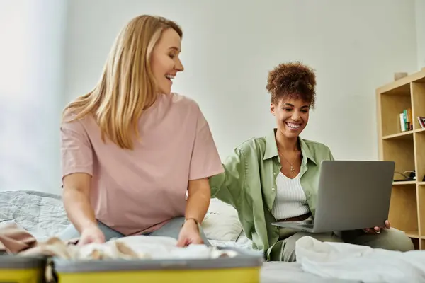 Two partners share laughter and excitement while preparing for their adventure. — Stock Photo